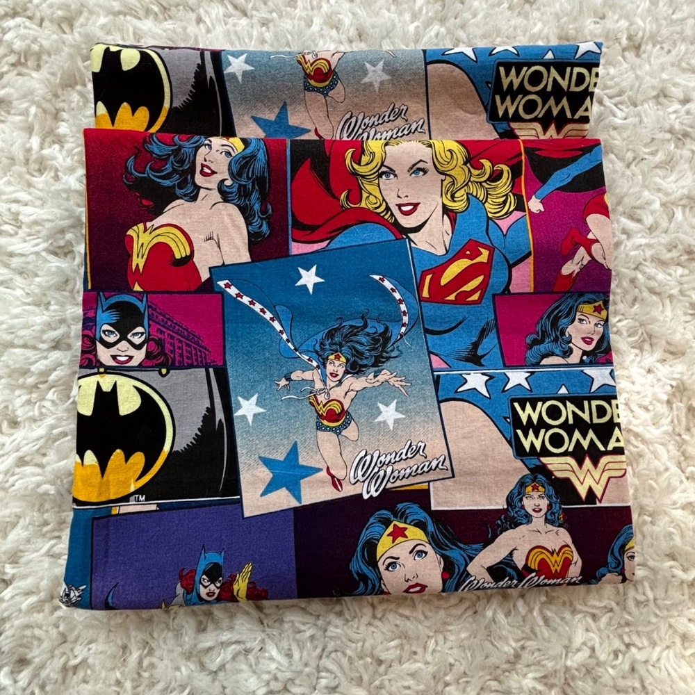 Piece of crafting sewing fabric featuring iconic female DC Comics characters